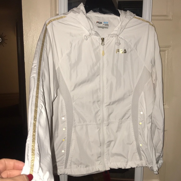 white and gold fila shirt